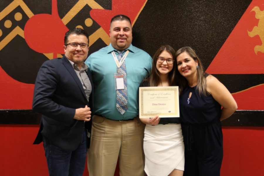 Senior Dina Orozco poses with her honored educator, Mr. Castruita and her parents at the Top 15 dinner.