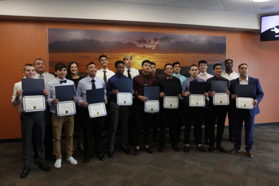 Varsity basketball boys recognized by City Hall for memorial clean-up