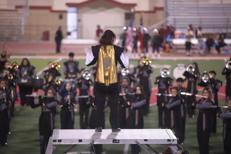 Senior drum major Alanni Alvarez directs the band during a pre-game performance at Bel Air High School on Nov. 5. 