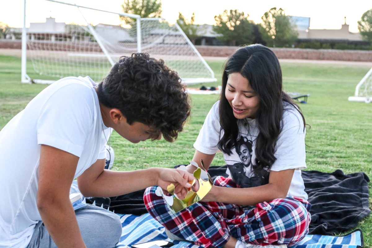 Senior couple Haley Pinon and Yahir Vazquez decorate their crowns on August 4, 2023 on the Field of Dreams