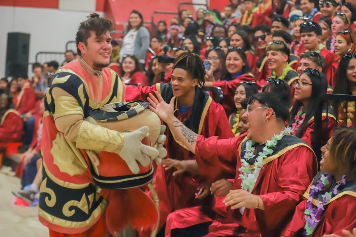 With a big smile, senior Andrew Fierro reveals his identity as Monty the mascot. The senior class cheered with excitement knowing that Fierro was the one who was by their side at every event.
