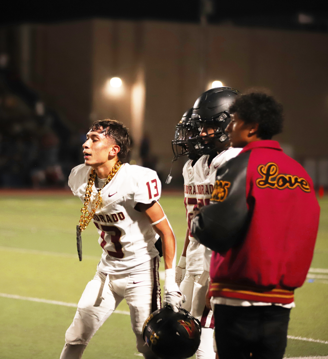 Game Changer. 
Moving with a purpose, junior Andrew Estrada walks to the sideline with the “turn over chain” around his neck on Sept. 20 at Eastwood High School. The chain was put around Estrada’s  neck because of his defensive turnover against the Troopers. “I got an interception late in the game to sway the momentum in my team's favor when we needed it most,” Estrada said. “It was a surreal experience to be able to contribute to a big win for the Empire.” 