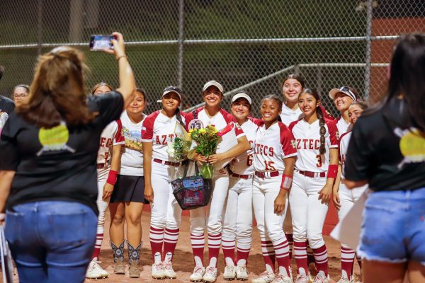 A Memory in a Snap. Posing for a group picture, senior Carmen Vargas, juniors Jezzelle Marquez, Scarlette Serna, Alannah Rabb, Nevaeh Matsuda along with freshmen Alyssa Lopez and Sophia Lujan smile at the camera on April 17 for the senior night game, winning 10-9 against Del Valle High School. “I would like to tell the underclassmen that this game does not define who you are. There is so much more beyond this sport, don't take it for granted the time you have left; it will all soon be over within a blink of an eye. Remember that this game is meant to be fun and not anything else. Respect the game and it will reward you back,” Vargas said. 