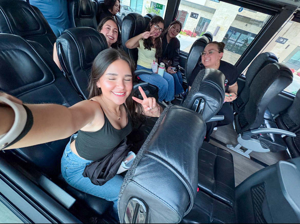 Selfie Mode. Raising the phone up high, squeezing into the photo, juniors Iratze Rede, Aliana Acuna, Frida Estrada,  Miley Pinon and Journalism Teacher Vanessa Martinez aim to get the perfect angle. On their way to the campus of Texas Tech, they board their bus. “My favorite part was being able to get closer to the people on the trip,” Rede said.